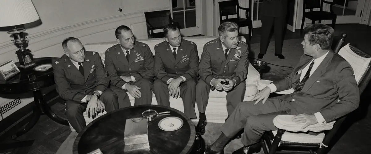 Turning Point: The Bomb and the Cold War. JFK with United States Air Force officers during Cuban Missile Crisis. Cr. Courtesy of Netflix © 2024